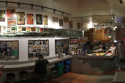 Escape from new york pizza - A glass case on the counter held about six to seven different pizzas, and the place smelled delicious. An eclectic array of music, from hip-hop to jazz to death metal, pumped through the vintage ...
